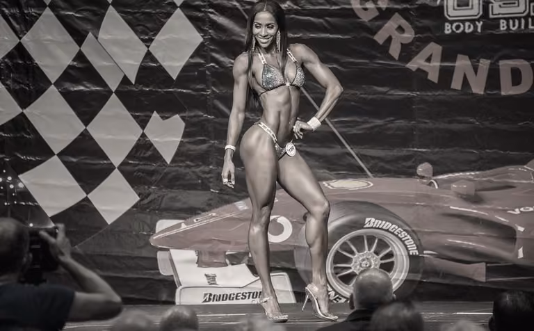 An IFM competitor on stage at a Grand Prix show.